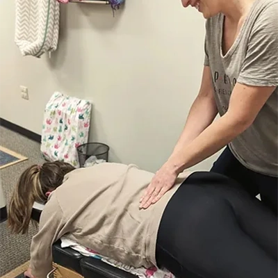 Chiropractic Cary NC Woman Receiving Adjustment